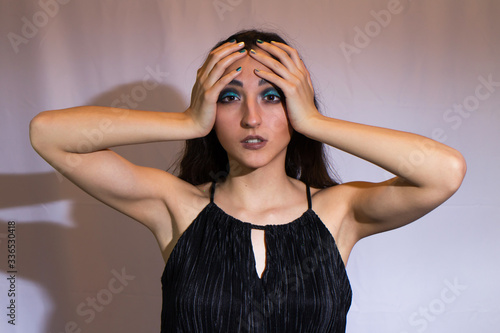 A beautiful woman dressed in color black 
