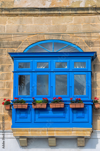 Bright blue balcony, typica...