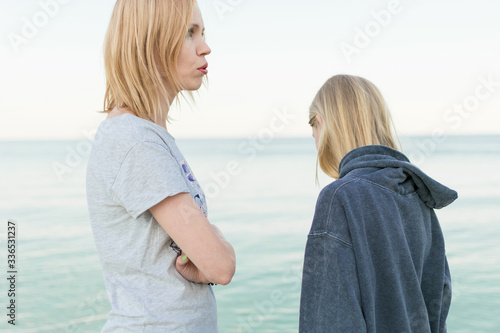 Mother and daughter are teenagers in conflict, grievances, unpleasant conversation. Mutual understanding between the parent and the child.