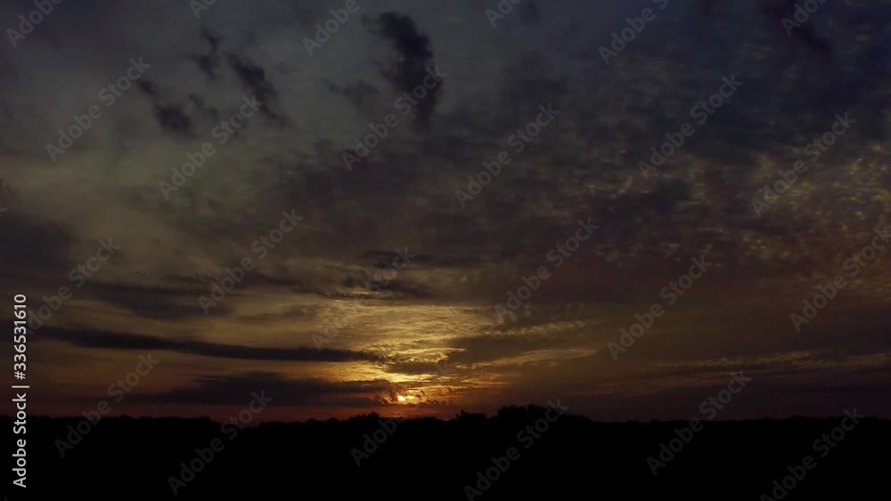 Very subtle moving clouds during a morning sunrise and a bird of prey with a little morning hunting. Very subtle moving clouds during a morning sunrise and a bird of prey with a little morning hunting.