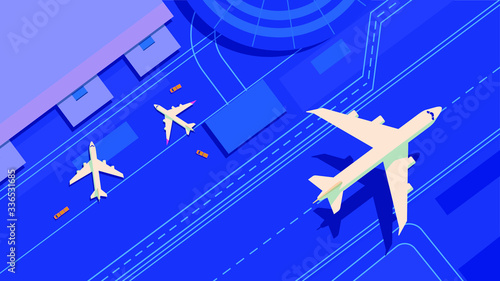 A top aerial view of an airport terminal and runway with parked commercial and passenger airplanes. Airplane on take-off approach at the airport runway.  