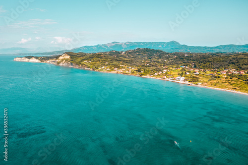 Aerial top view of summer beach and sea.Free space for your decoration and sunny warm day.Corfu island of Greece.  © magdal3na