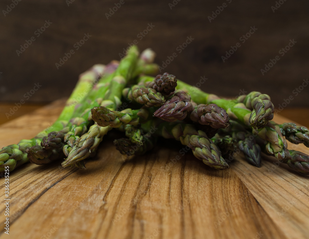 fresh asparagus on wooden table fresh asparagus on wooden table