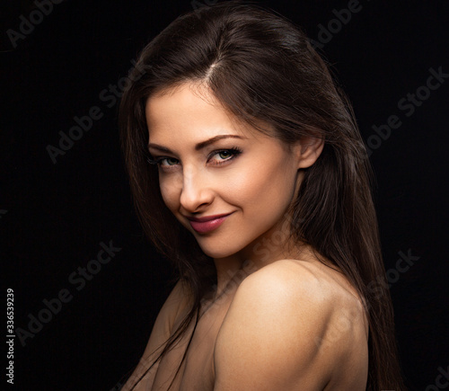 Beautiful smiling sexy woman with long hair looking with red lipstick on black background. Closeup portrait. Art.Expression portrait.