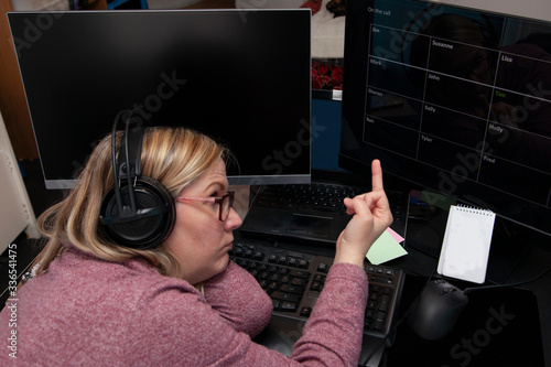 frustrated woman on a work from home call photo