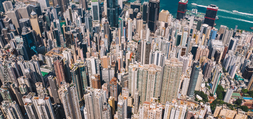 Aerial scenery panoramic view from drone of Hong Kong modern skyscrapers district. Top view, urban downtown with corporate business and financial enterprise buildings. Metropolitan city infrastructure
