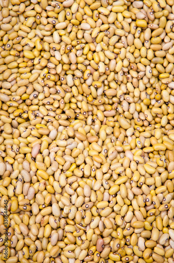Full frame background of dried yellow kidney (also known as African yellow) beans at an outdoor farmers market Full frame background of dried yellow kidney (also known as African yellow) beans at an outdoor farmers market