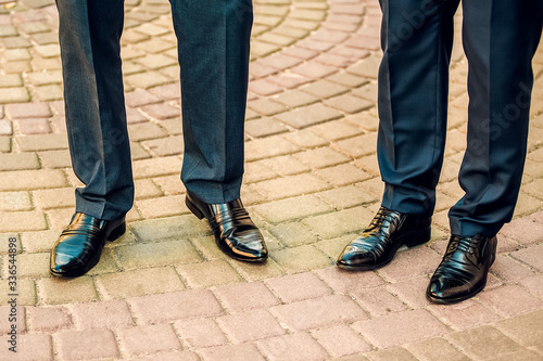 Legs of men in shoes