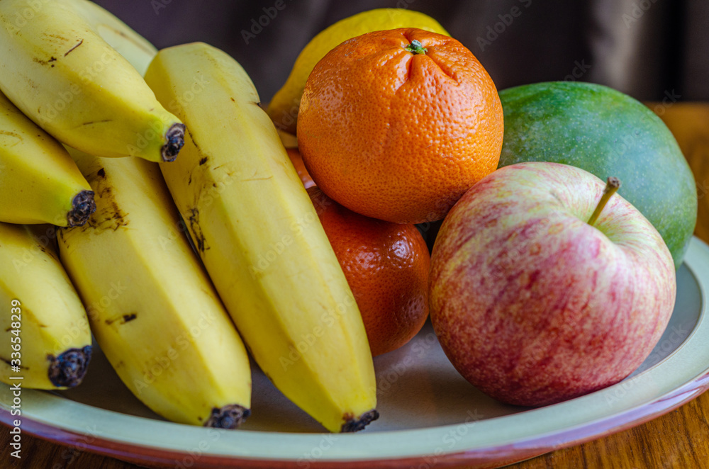 Ana assortment of fresh fruit in a plate. Ana assortment of fresh fruit in a plate.