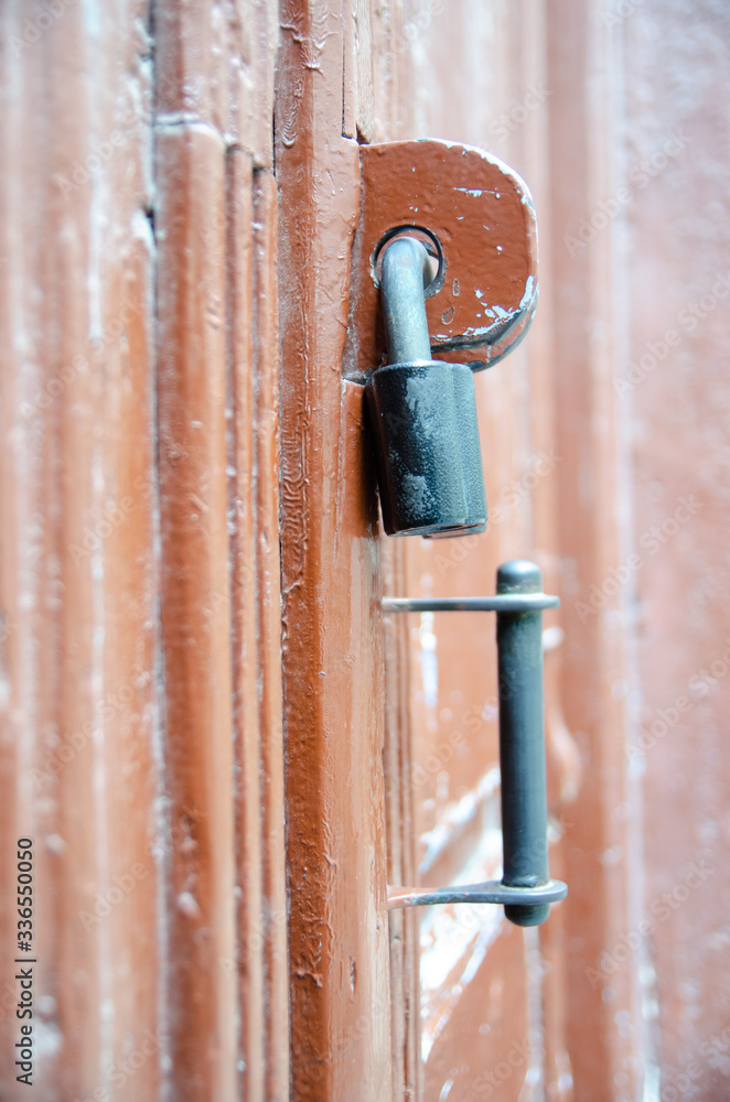 Antique door lock on a wooden door