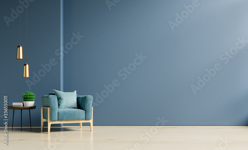 The interior has a armchair on empty dark blue wall background. photo