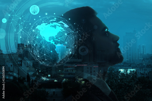 Triple exposure of businessman, model of Earth and modern city
