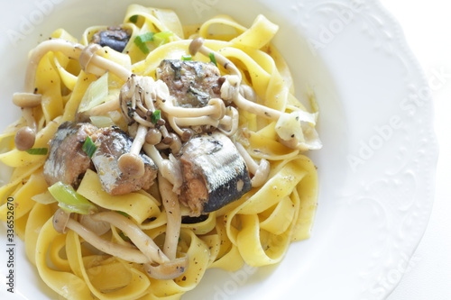 Italian food, sardines and fettuccine pasta 