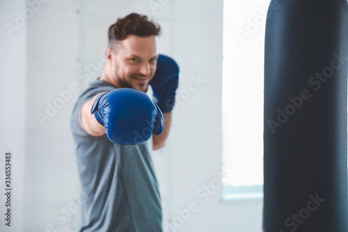 Male boxer training in gym