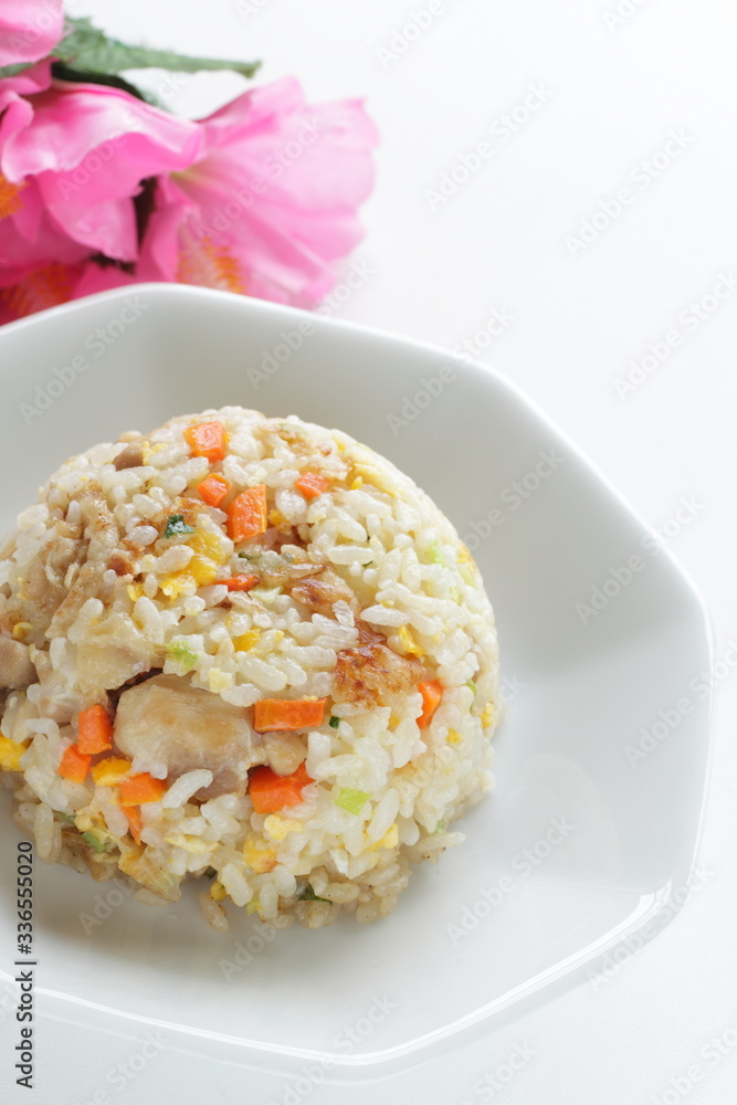Chinese food, chicken and carrot fried rice on white plate Chinese food, chicken and carrot fried rice on white plate
