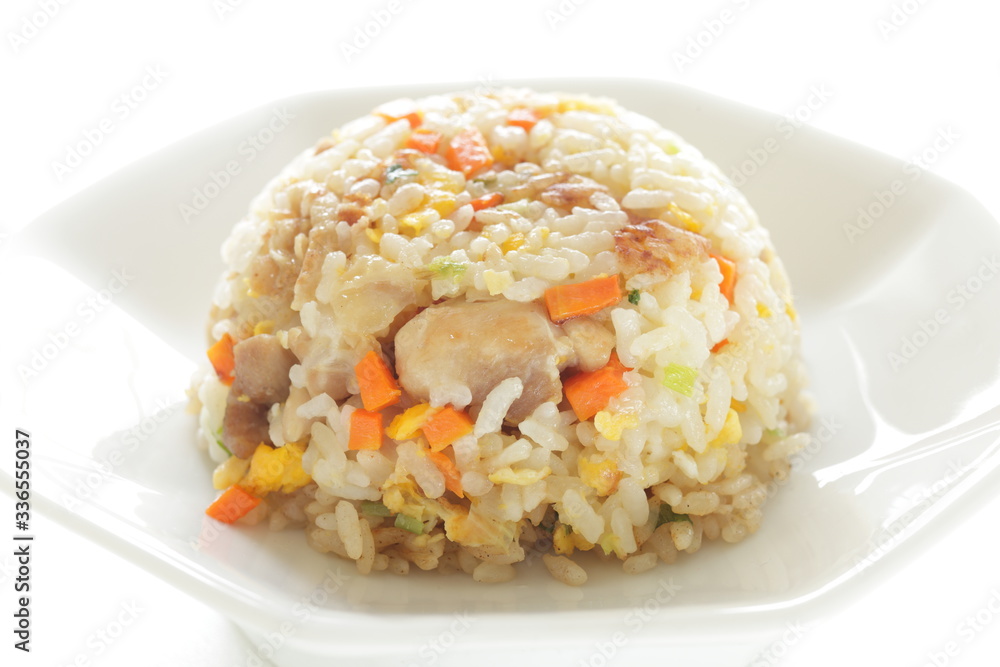 Chinese food, chicken and carrot fried rice on white plate Chinese food, chicken and carrot fried rice on white plate
