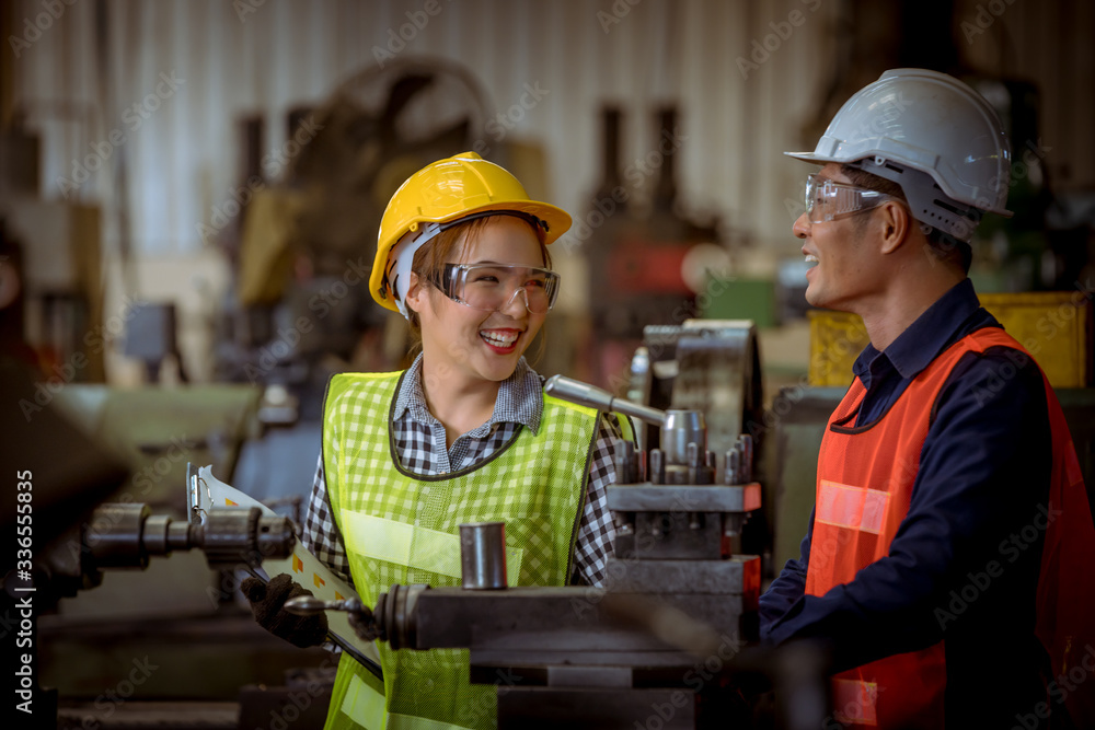 The Industry engineering and worker wearing glass, safety uniform used Vernier caliper to measure the object control operating machine working and worker report in file paper industry factory. The Industry engineering and worker wearing glass, safety uniform used Vernier caliper to measure the object control operating machine working and worker report in file paper industry factory.