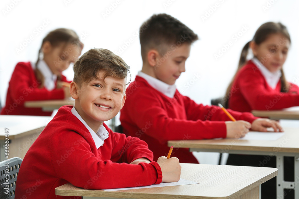 Pupils passing exam at school Pupils passing exam at school