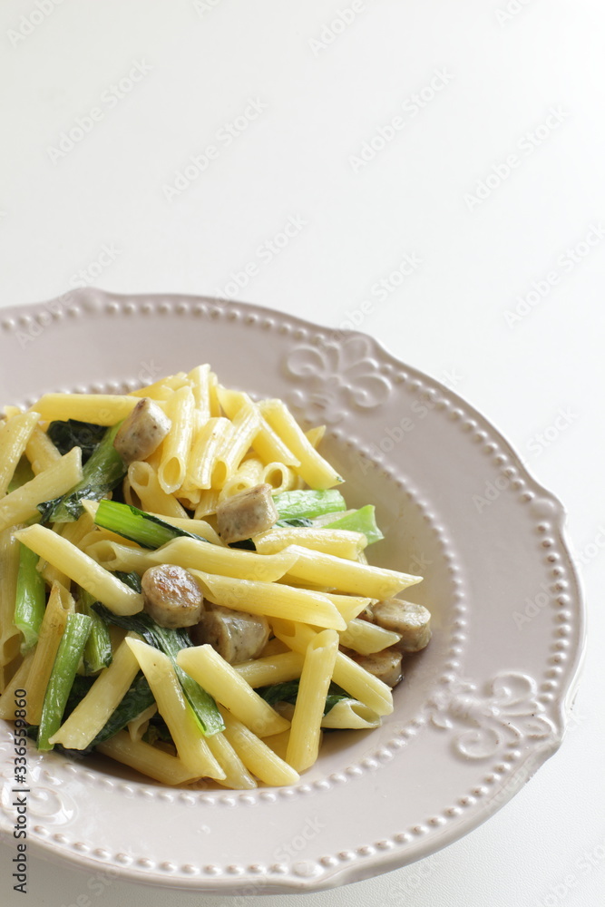 Italian food, penne and sausage with green leaf vegetable
Italian food, penne and sausage with green leaf vegetable