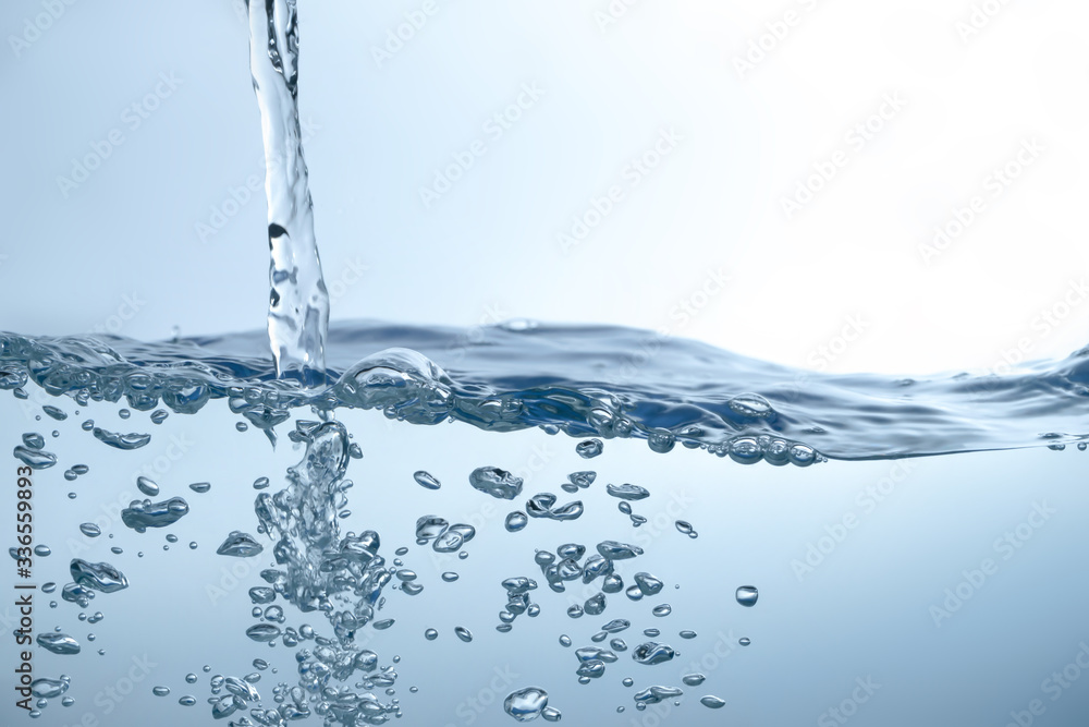 Water splash on blue background. Aqua flowing in waves and creating bubbles. Drops on the water surface feel fresh and clean. Water splash on blue background. Aqua flowing in waves and creating bubbles. Drops on the water surface feel fresh and clean.