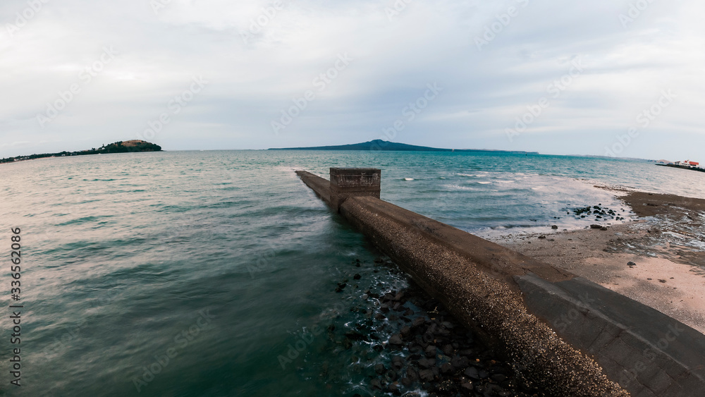 Landscape photo of the ocean, looking at Rangitoto Island in Auckland. The photo is taken with the DJI OSMO Action Camera.