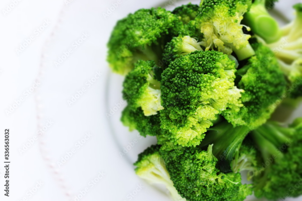 Boiled broccoli on dish with copy space