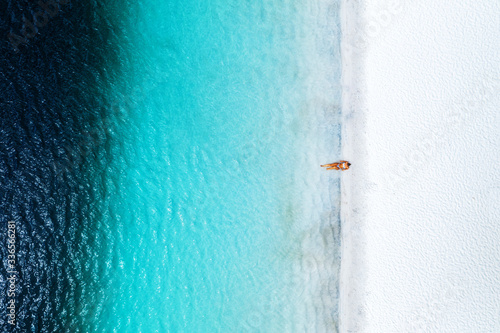 Alone swimmer in blue water Lake Mckenzie Fraser Island Queensland Australia 