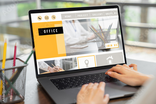 business woman using website on digital laptop on desk.