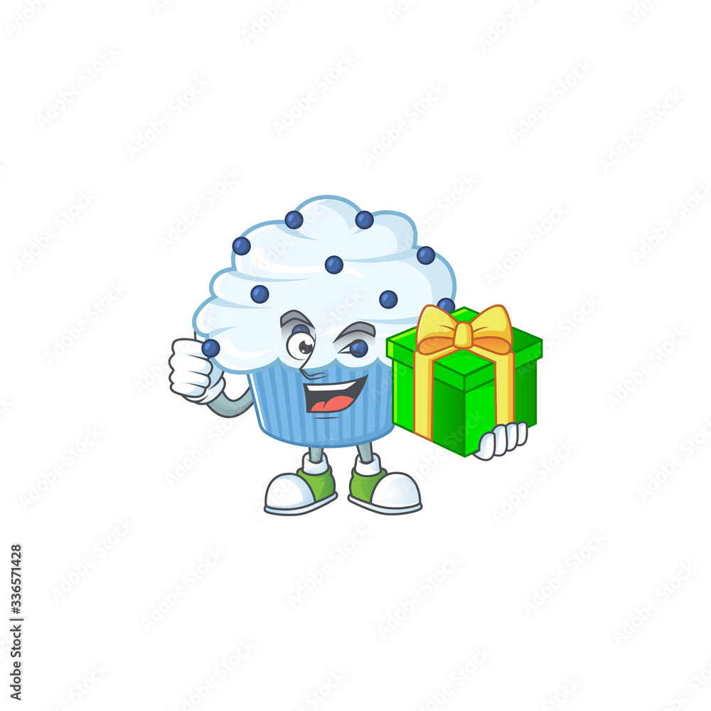 Smiley vanilla blue cupcake cartoon character holding a gift box