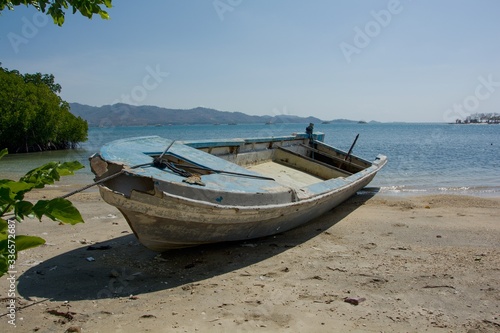 Boat on the beach at low tide  Lombok