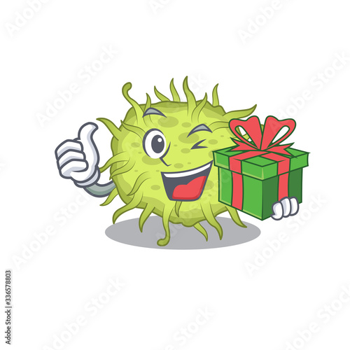 Smiling bacteria coccus cartoon character having a green gift box