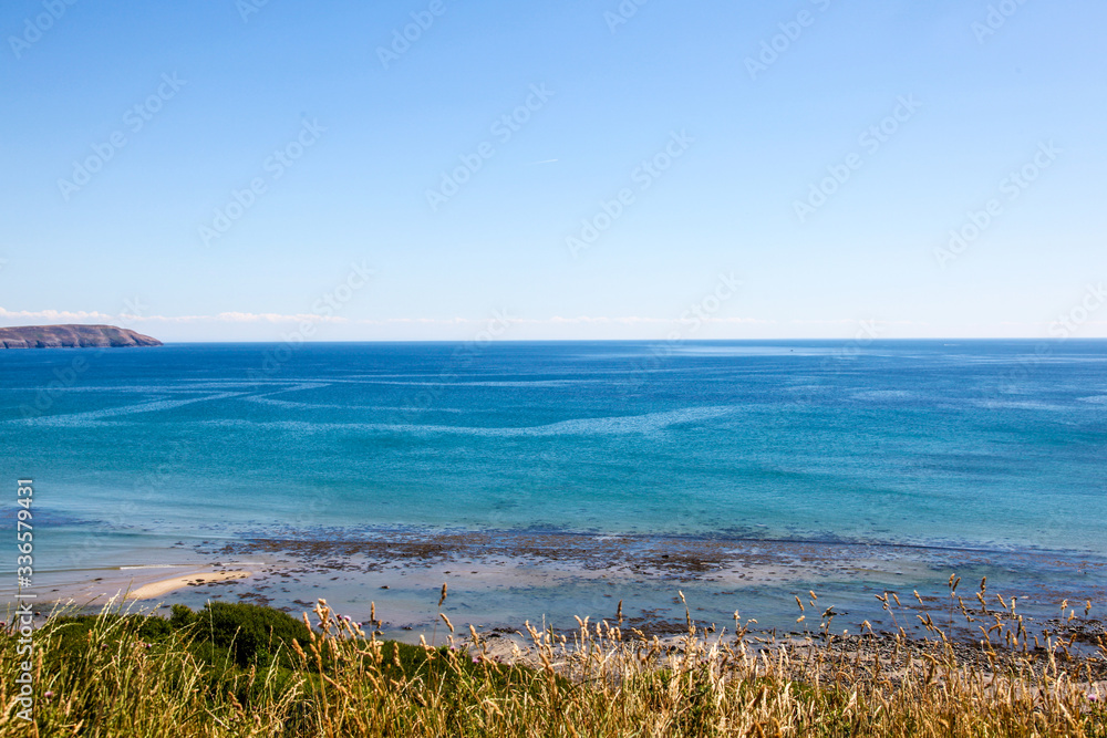 Blue sky coastal edge, beach, sea and blue skies