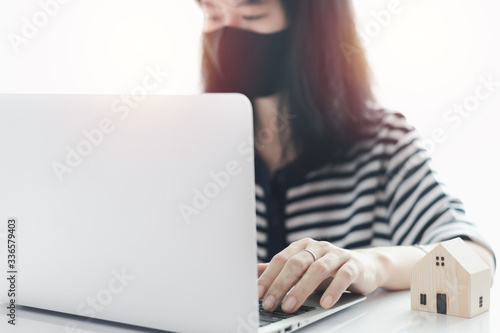 Woman using laptop and work...