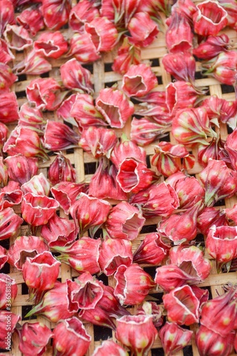 dry red roselle flower on bamboo basket