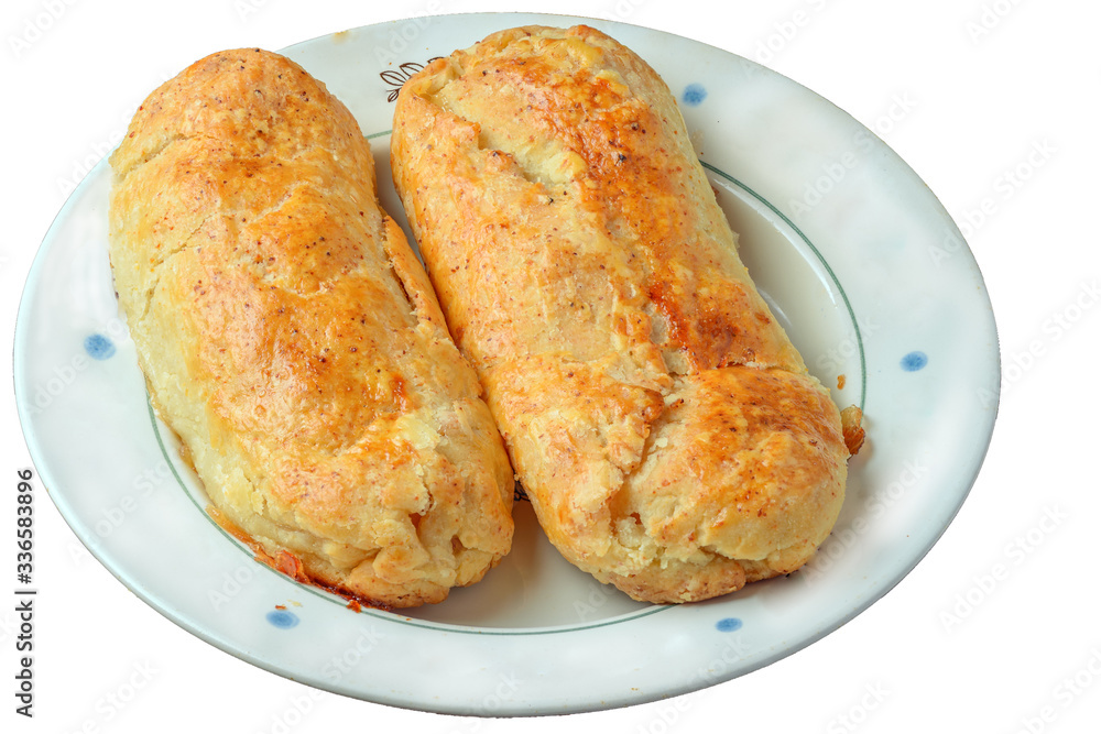 Apple rolls made of yeast-free dough, placed on a plate, isolated on a white background Apple rolls made of yeast-free dough, placed on a plate, isolated on a white background