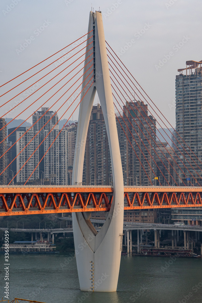 Fototapeta premium Qian si men suspension bridge tower over Jialing river in Chongqing, China