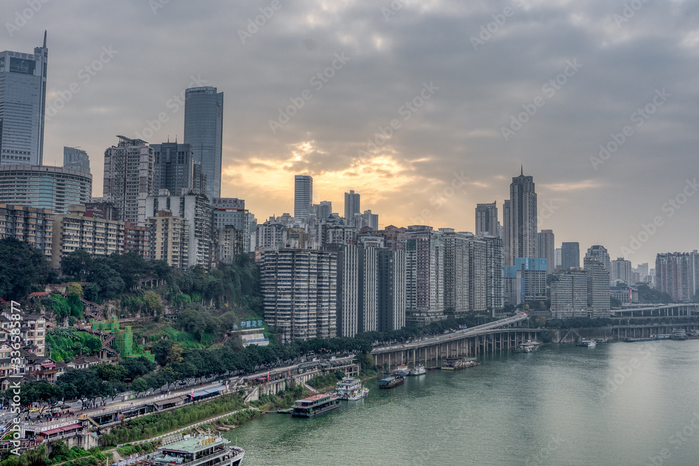 Sunset over residence buildings by Jialing river in Chongqing, China Sunset over residence buildings by Jialing river in Chongqing, China