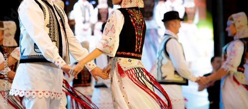 Romanian traditional national costumes on folkloric dancers  photo