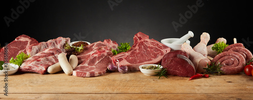 Display of assorted raw meats for barbecuing photo