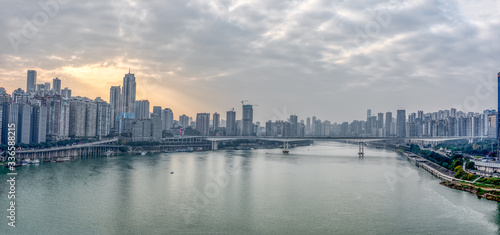 Chongqing, China - Dec 22, 2019: Pano view of Sunset over Jialing river with dense residence buiding
