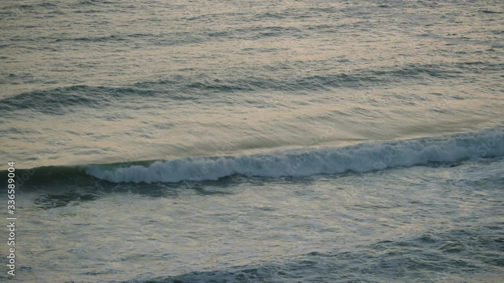 Waves roll into a bay at dusk in Cornwall, UK.
(Shot on Arri Alexa Mini LF) Waves roll into a bay at dusk in Cornwall, UK.
(Shot on Arri Alexa Mini LF)