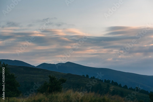 Beautiful Carpathians, mountains in clouds, waterfall, close-up, the sunsets beautifully over the mountains © Ihor