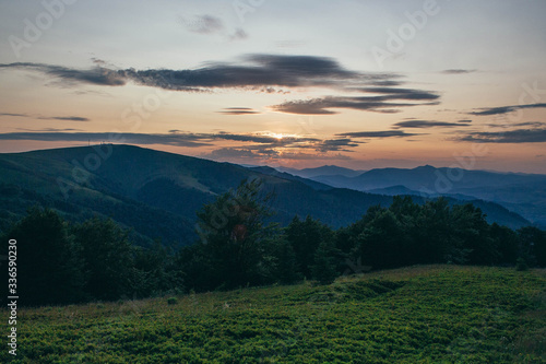 Beautiful Carpathians, mountains in clouds, waterfall, close-up, the sunsets beautifully over the mountains
