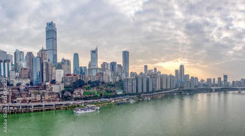 Chongqing, China - Dec 22, 2019: Sunset over Jialing river with dense residence buiding