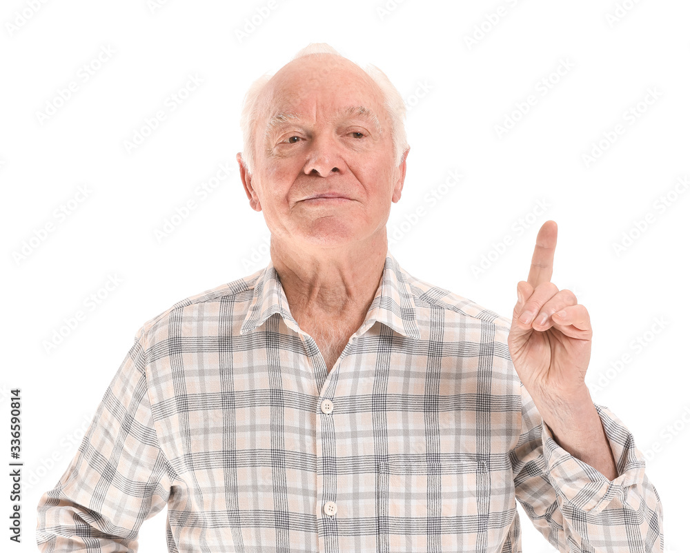 Portrait of elderly man with raised index finger on white background Portrait of elderly man with raised index finger on white background
