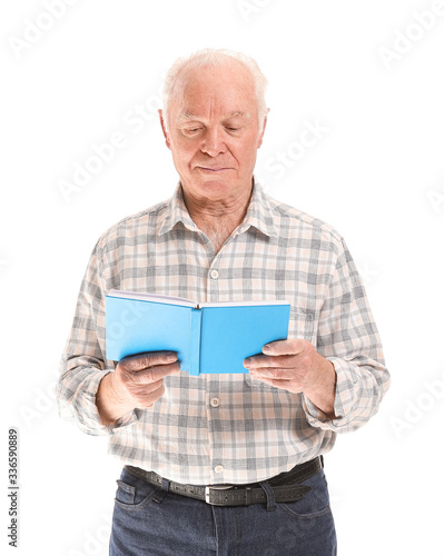 Portrait of elderly man rea...