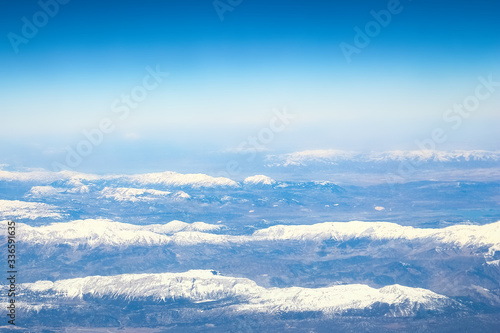 Beautiful earth and sea from a window airplane background © Kostia