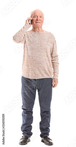 Portrait of elderly man tal...