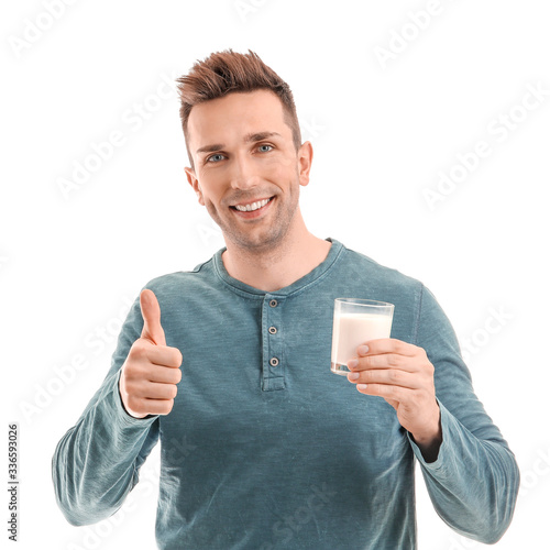 Young man with milk showing...