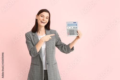 Young woman with calculator...
